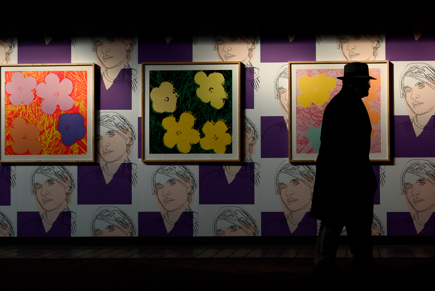  A traveler walks near Pittsburgh native Andy Warhol's "Self Portrait Wallpaper" and "Flowers" on display at Pittsburgh International Airport on December 14, 2017 in Moon, Pa. 
CREDIT: Justin Merriman for The Wall Street Journal 