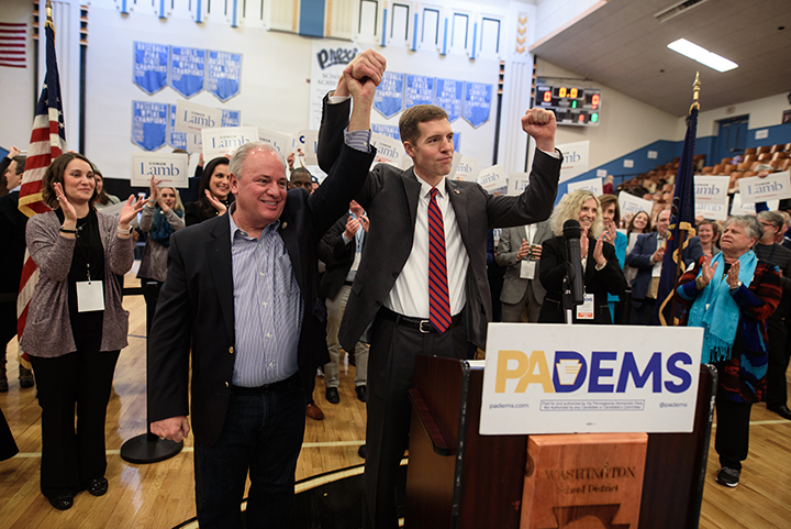  Congressman Michael Doyle, left, hoists Conor Lamb's arm after Lamb won the Democratic committee members nomination for Pennsylvania's 18th District on November 19, 2017 at Washington High School in Washington, Pa. 

Lamb, a 33-year-old Marine veter