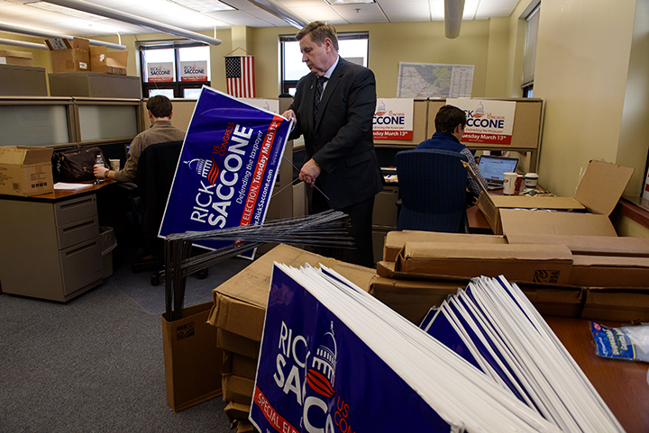  Rick Saccone, a Republican state lawmaker running for a US House seat in Pennsylvania's 18th Congressional District puts together campaign signs in his office on February 8, 2018 in Canonsburg, Pa.  