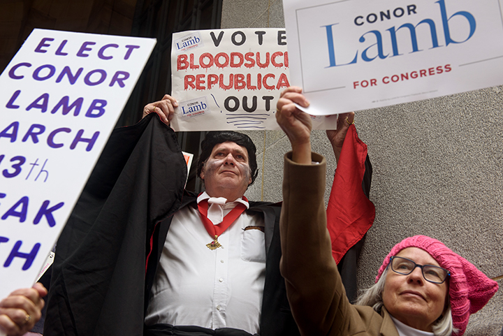  Conor Lamb supporter Fred Bender, center, 70, of Peters Township, holds a sign saying, "Vote Bloodsucking Republicans Out," as he joins in The Women's March on Washington - Pittsburgh "Power to the Polls" in Market Square on Sunday afternoon, Januar