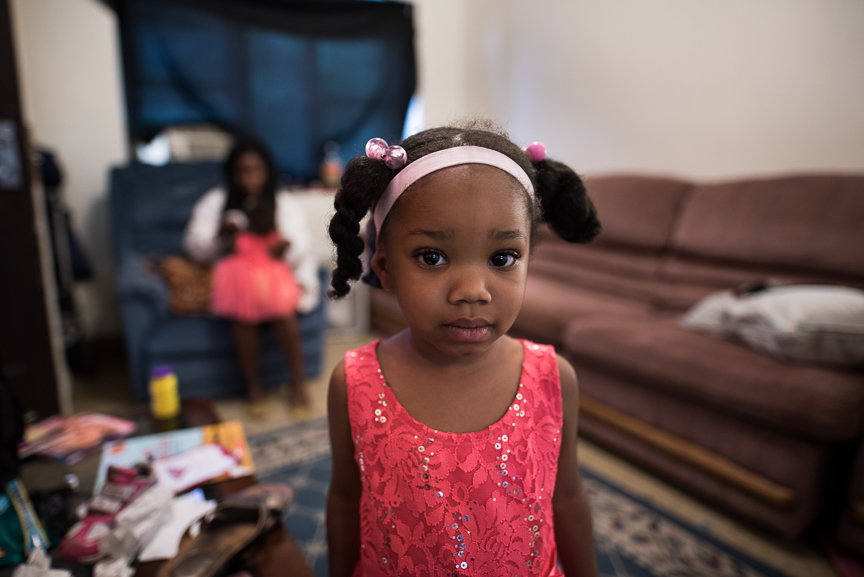  Trinity Glenn, 3, stands in her grandmother's living room on June 9, 2017 in Fineview, a neighborhood in Pittsburgh, Pa.  