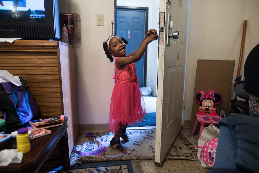  Trinity Glenn, 3, stands in the doorway of her grandmother's living room. 