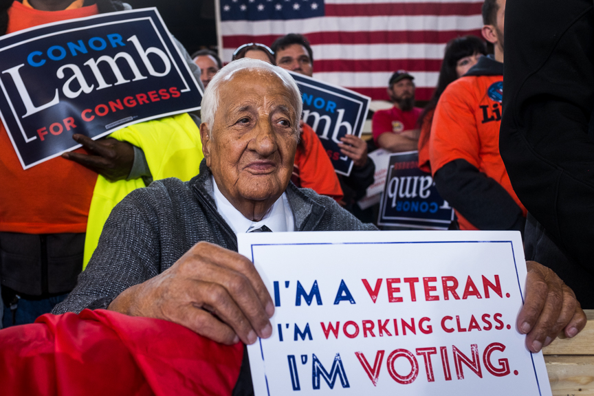  Johnny Bento, a longtime supporter of unions in Pittsburgh, listens to former Vice President Joe Biden speak at a rally for Conor Lamb, Democratic candidate for Pennsylvania's 18th Congressional District, at the Carpenters Training Center on Tuesday