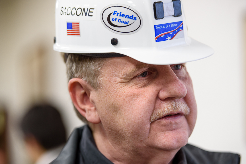  Rick Saccone wears a miner's helmet he was gifted as he talks with supporters at the VFW Post 4793 after a campaign rally on March 5, 2018 in Waynesburg, Pa.  