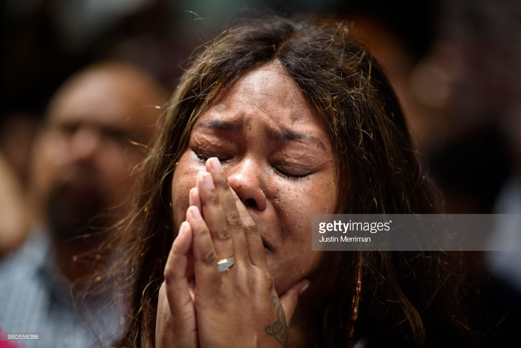  Malika Collins-Berry of Wilkinsburg, Pa., cries as she joins a rally in front of the Allegheny County Courthouse on June 21, 2018 in Pittsburgh, Pennsylvania. Over 200 people gathered in the aftermath of a fatal shooting of Antwon Rose, an unarmed b