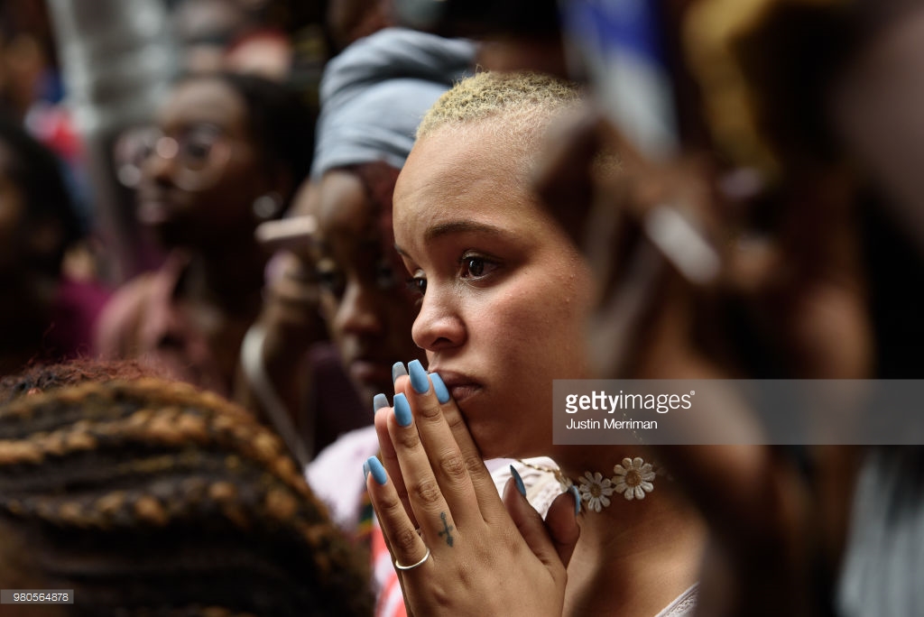  Cherise Green, 24, of Pittsburgh's Hill District, joins over 200 people gathered for a rally to protest the fatal shooting of an unarmed black teen at the Allegheny County Courthouse on June 21, 2018 in Pittsburgh, Pennsylvania. Antwon Rose, 17, was