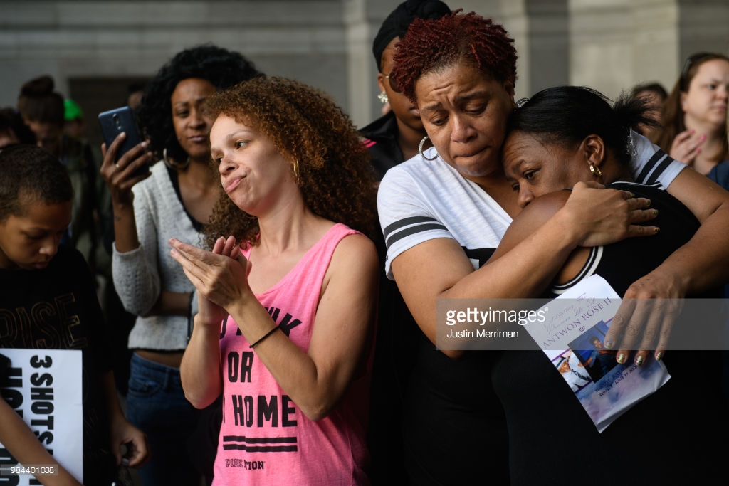  Family of Antwon Rose II embrace as they listen to speakers during a protest calling for justice for the 17-year-old on June 26, 2018 in Downtown, Pittsburgh, Pennsylvania. Rose was killed by an East Pittsburgh police officer on Tuesday, June 19 whe