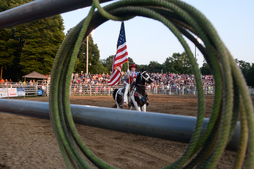  The U.S. flag brought into the arena for the National Anthem at the Fort Armstrong Championship Rodeo on Friday, July 13, 2018 at the Crooked Creek Horse Park in Ford City, Pa. 