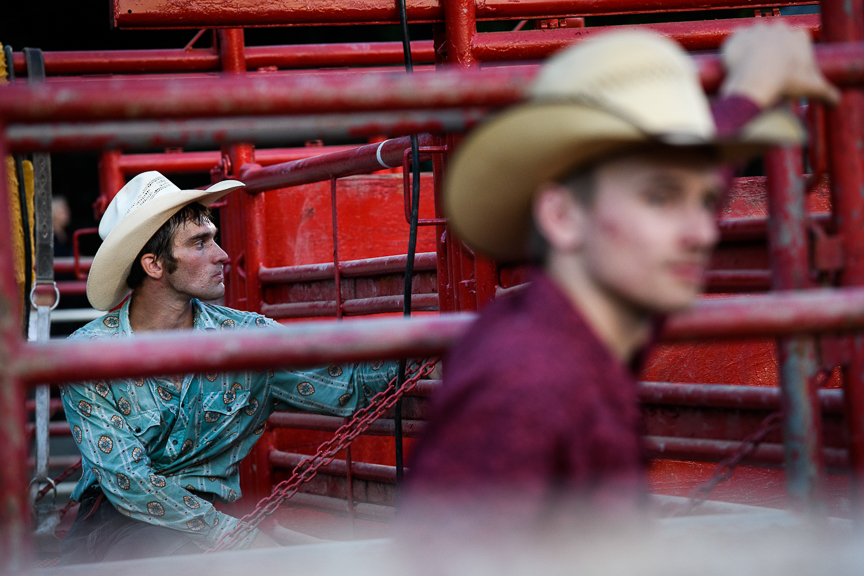  Cowboys stand in the pens as they watch the Fort Armstrong Championship Rodeo on Friday, July 13, 2018 at the Crooked Creek Horse Park in Ford City, Pa. 