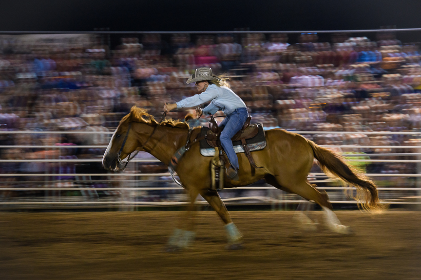  A rider competes in the barrel racing competition during the Fort Armstrong Championship Rodeo on Friday, July 13, 2018 at the Crooked Creek Horse Park in Ford City, Pa. 