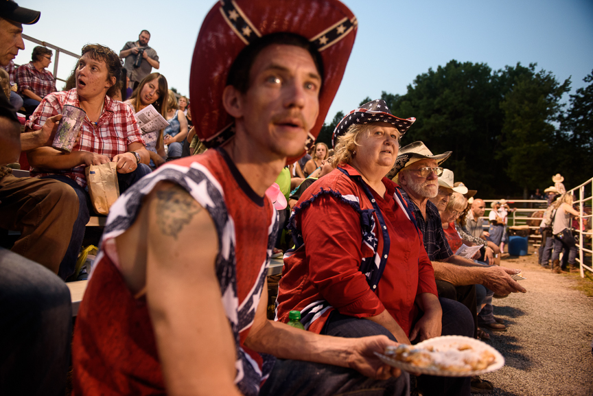  Doris Wolfe, 62, center, sits with her son, John, left, as they watch the Fort Armstrong Championship Rodeo on Friday, July 13, 2018 at the Crooked Creek Horse Park in Ford City, Pa. 