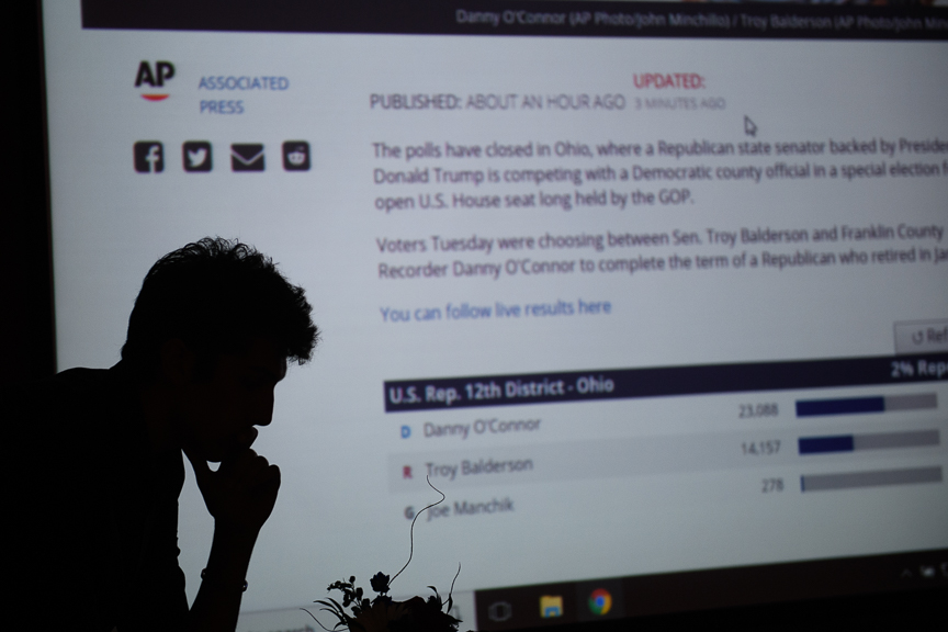  Bruno Leone, 18, of Alliance, Ohio, a supporter of Republican congressional candidate Troy Balderson, looks at early returns in Ohio's special election for the 12th Congressional District at Balderson's election night party at the DoubleTree by Hilt