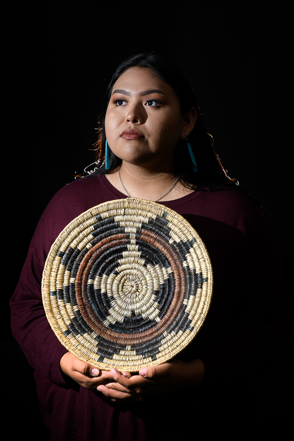  Marion Sequaptewa, 16, holds her great grandfather's ceremonial basket, as she is photographed at San Juan High School on October 2, 2018 in Blanding, Utah. "My Grandpa always tells me I'm not a true Navajo if I don't speak the language," she says. 