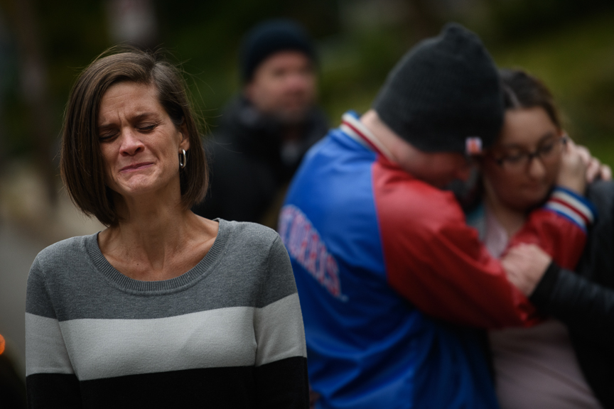  A woman beaks into tears as she visits a makeshift memorial near the Tree of Life Synagogue on Monday, October 29, 2018 in Pittsburgh's Squirrel Hill neighborhood.  