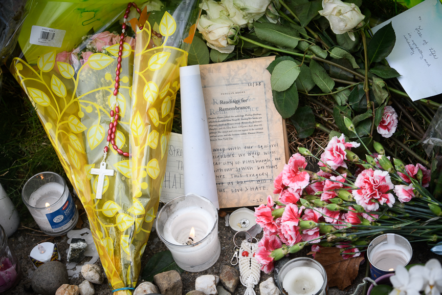  Mourners leave flowers and other items at a makeshift memorial near the Tree of Life Synagogue. 