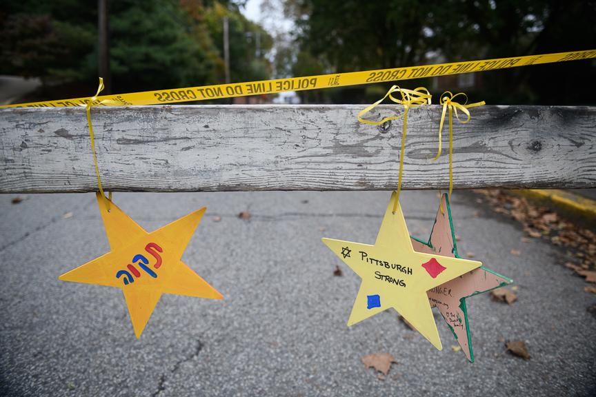  Items hang from a police roadblock near the Tree of Life Synagogue. 