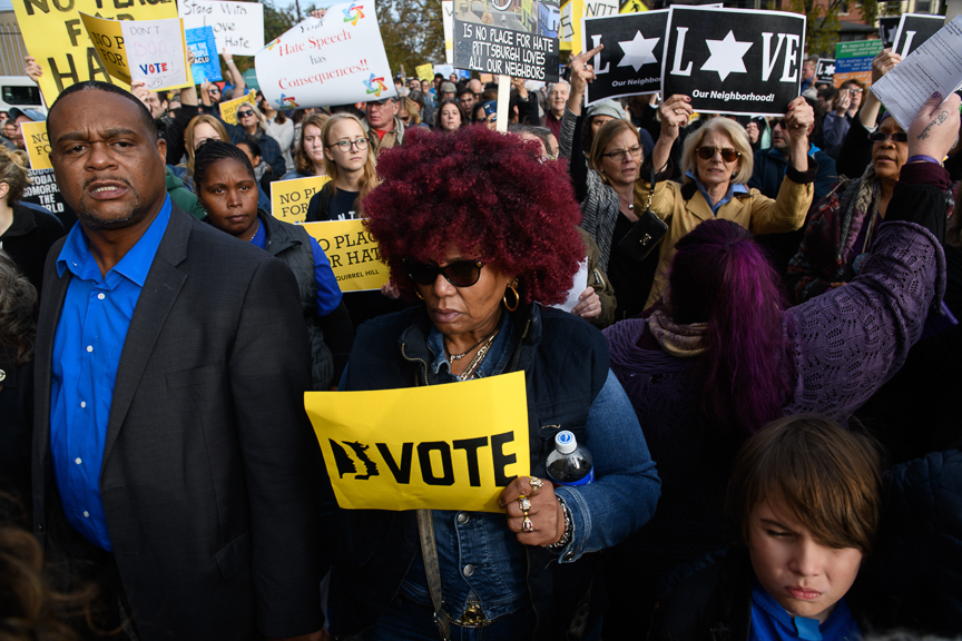  People march though the streets of Squirrel Hill in response to the visit by President Trump. 