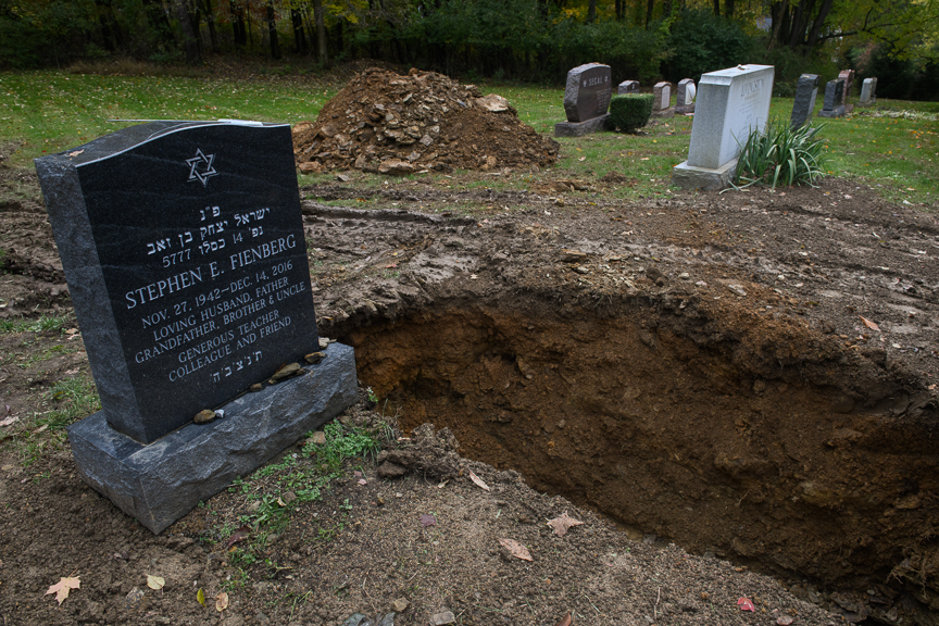  A freshly dug grave sits open at the Tree of Life Memorial Park on Monday afternoon, October 29, 2018 in Pittsburgh's North Hills.   