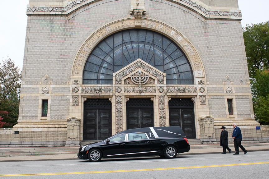  Men walk behind a hearse carrying the casket of Irving Younger, one of the victims of the Tree of Life Synagogue shooting, in front of Rodef Shalom Congregation after funeral services on Wednesday, October 31, 2018 in Pittsburgh's Oakland neighborho