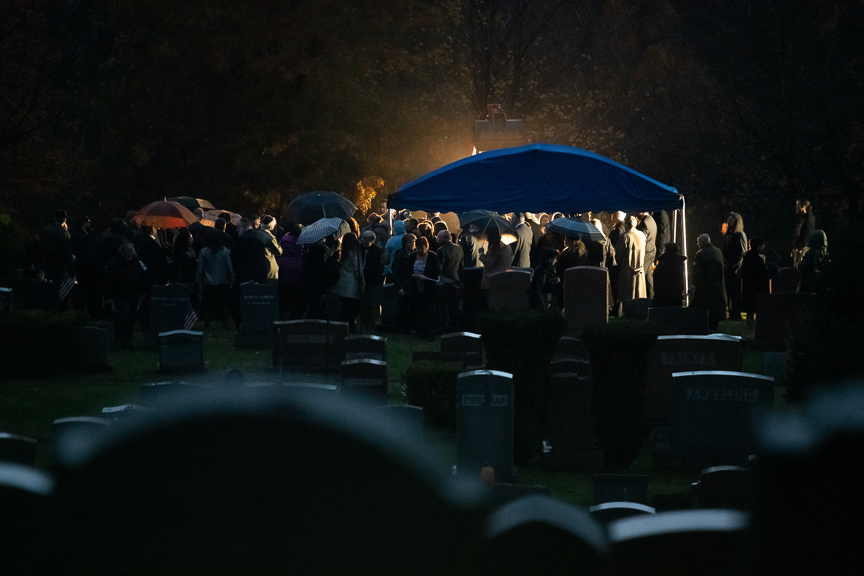  Mourners gather around the gravesite of Richard Gottfried during his burial service at New Light Cemetery on Thursday, November 1, 2018 in Etna, Pa.  