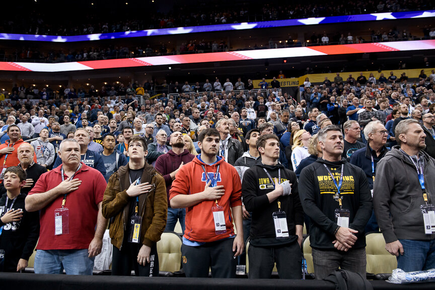  Wrestling fans listen to the National Anthem during the NCAA Division I Wrestling Championships on March 22, 2019 at PPG Paints Arena in Pittsburgh, Pennsylvania. 