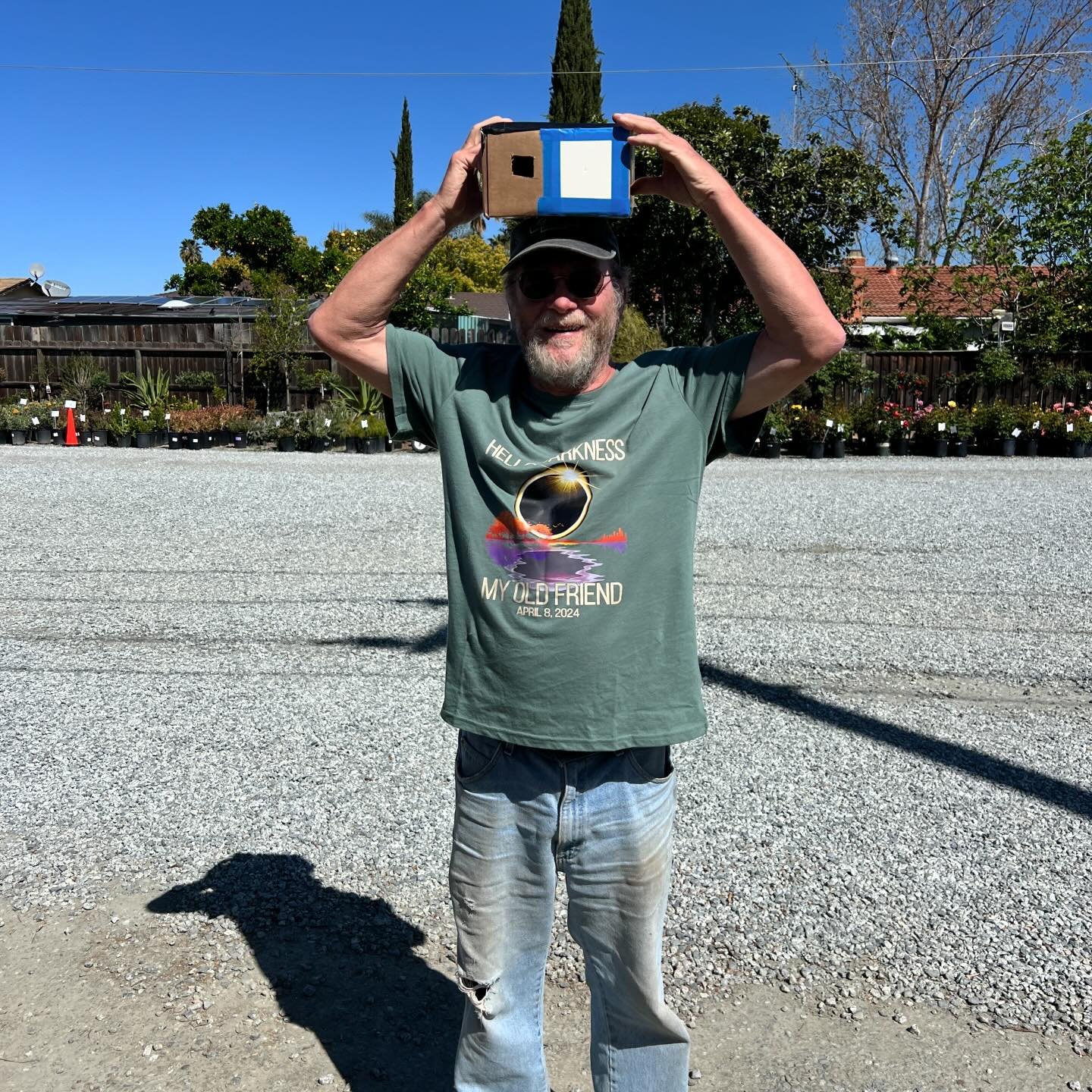 Dave wore his eclipse-themed tshirt for today&rsquo;s solar event! And is holding our homemade pinhole camera! ☀️ Swipe to see how Brandon uses the camera with his back to the sun. You can see a tiny image of the eclipse projected inside the box! 

A