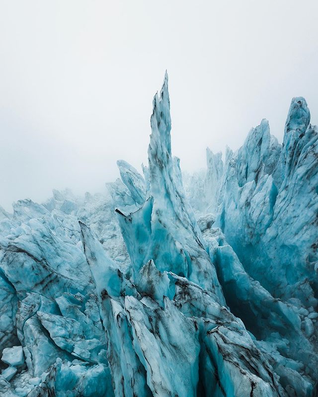 The ice pillars of Fallj&ouml;kull. 
High up in the icefall, where the glacier warps and bends over a steep mountain face, these intriguing structures balance against each other amidst their final stages of existence.
The thunderous sounds of crackin