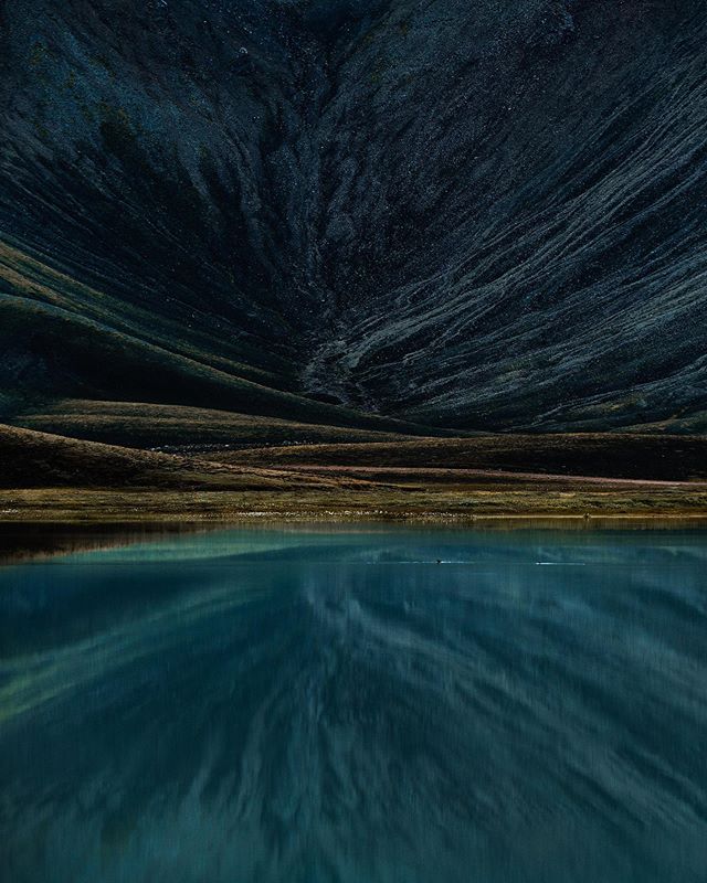 Autumn reflections. 
Couldn&rsquo;t believe my eyes when I passed this highland lake. It&rsquo;s usually a really windy location, so I&rsquo;ve rarely seen the water as still as this. The strange patterns reflected from the mountain above really put 