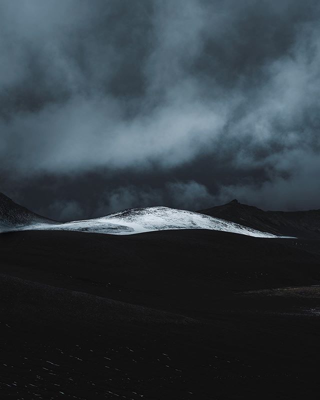 Natures contrast. 
First signs of snow over a dark volcanic landscape. Disappearing just a few hours later, these temporary and unique moments in the highlands are always worth the chase. 
#Iceland