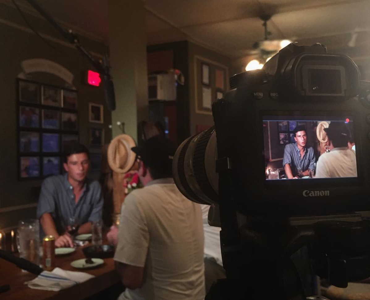 The host conducting an interview over outstanding wine and food at Cebo. restaurant in Geneva, New York.