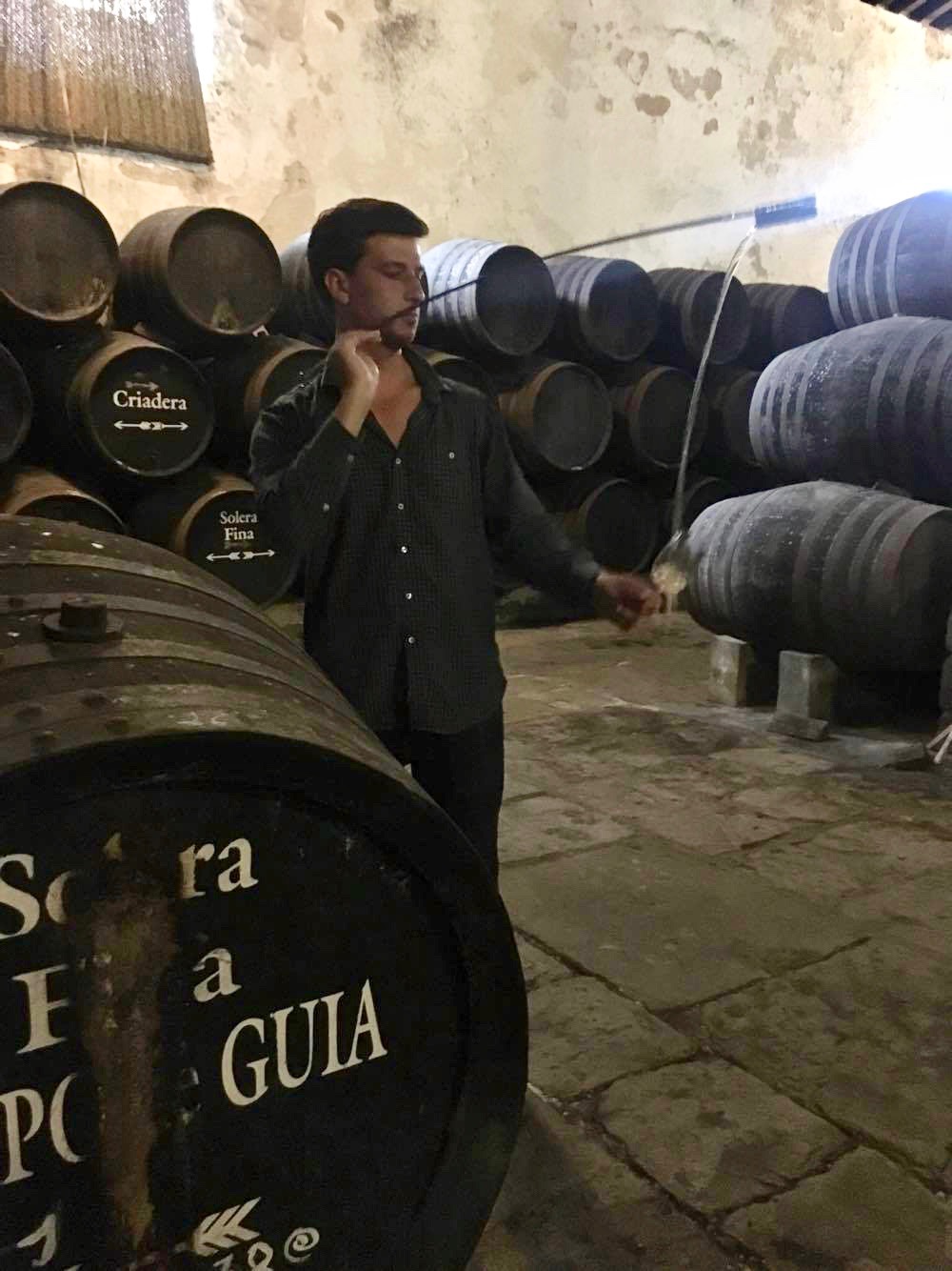 Jack tasting wine out of the barrel at Bodega Gutierrez-Colosia in El Puerto de Santa Maria, Spain. He was there to meet the family behind the winery and vet the wines for his wine bar in Charleston, South Carolina.