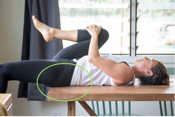 Good! Let your leg fall while holding your sacrum (or lower back) against the table. Hold and breath while you hip flexor slowly relaxes. see how my leg can only be released a little at first?