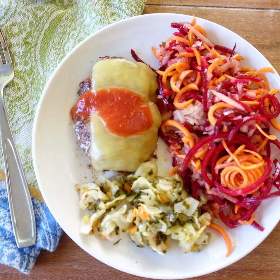 a typical "after meal": grassfed full fat beef with raw cheddar and fermented ketchup,, homemade fermented veggies, raw carrot and beet salad dressed with flax oil and balsamic.