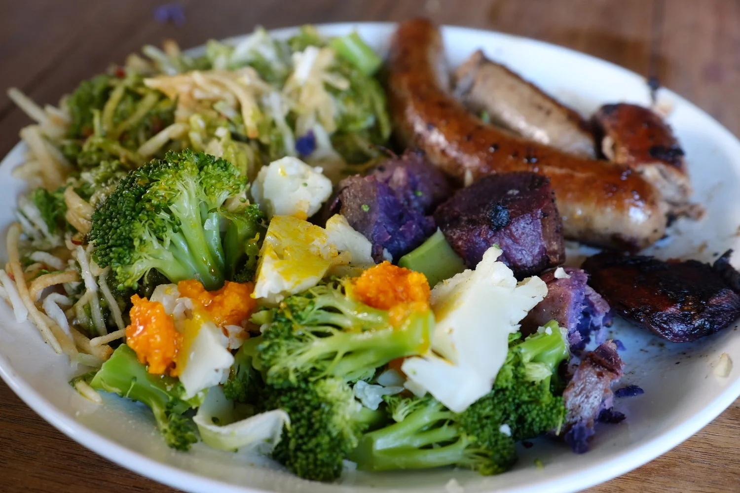 my lunch: full fat lamb sausages (100% grass fed), shredded apple/fennel salad with olive oil, steamed local broccoli and cauliflower with sustainably harvested palm oil