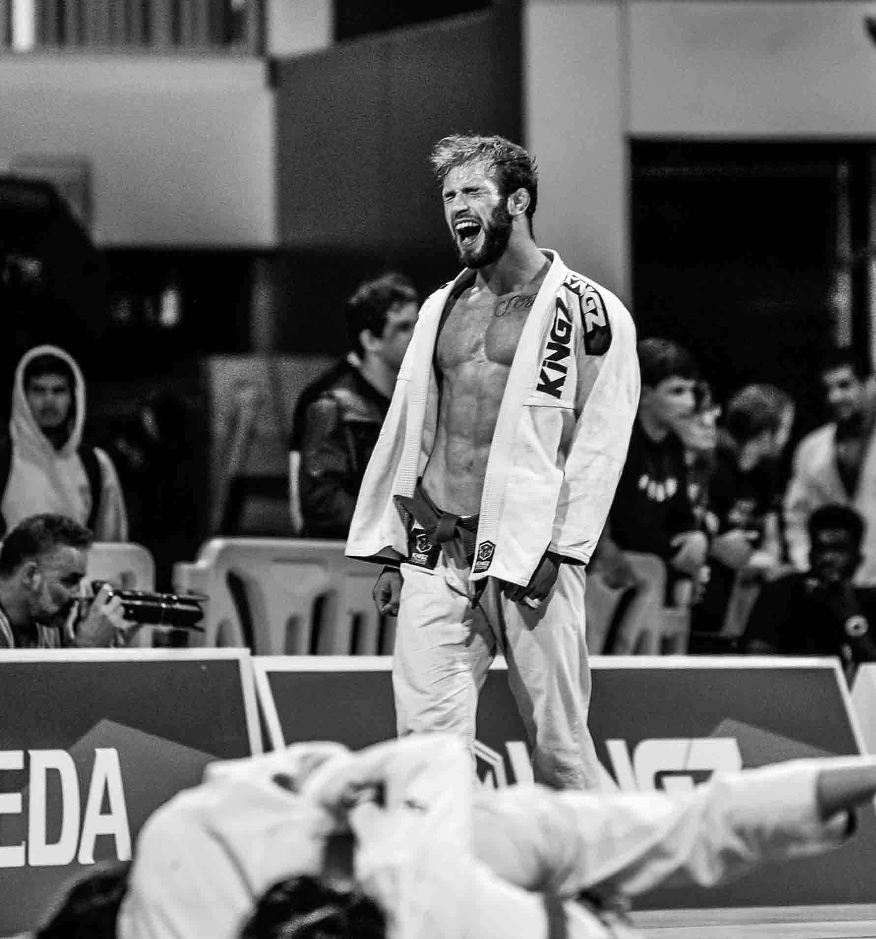 Purple Belt Adam Bradley of Atos Jiu Jitsu lets out a victory yell after moving on to the finals.
