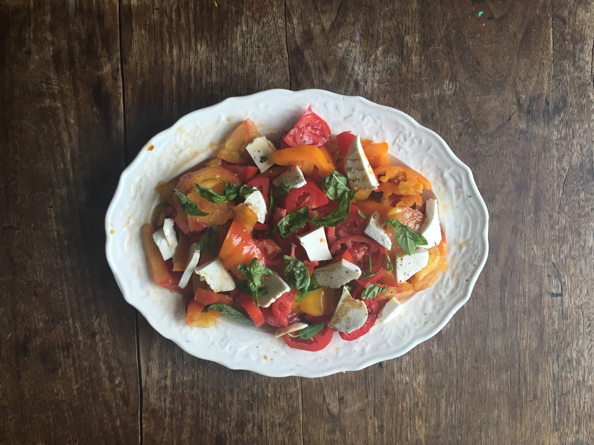 Maple balsamic vinaigrette served atop a caprese salad