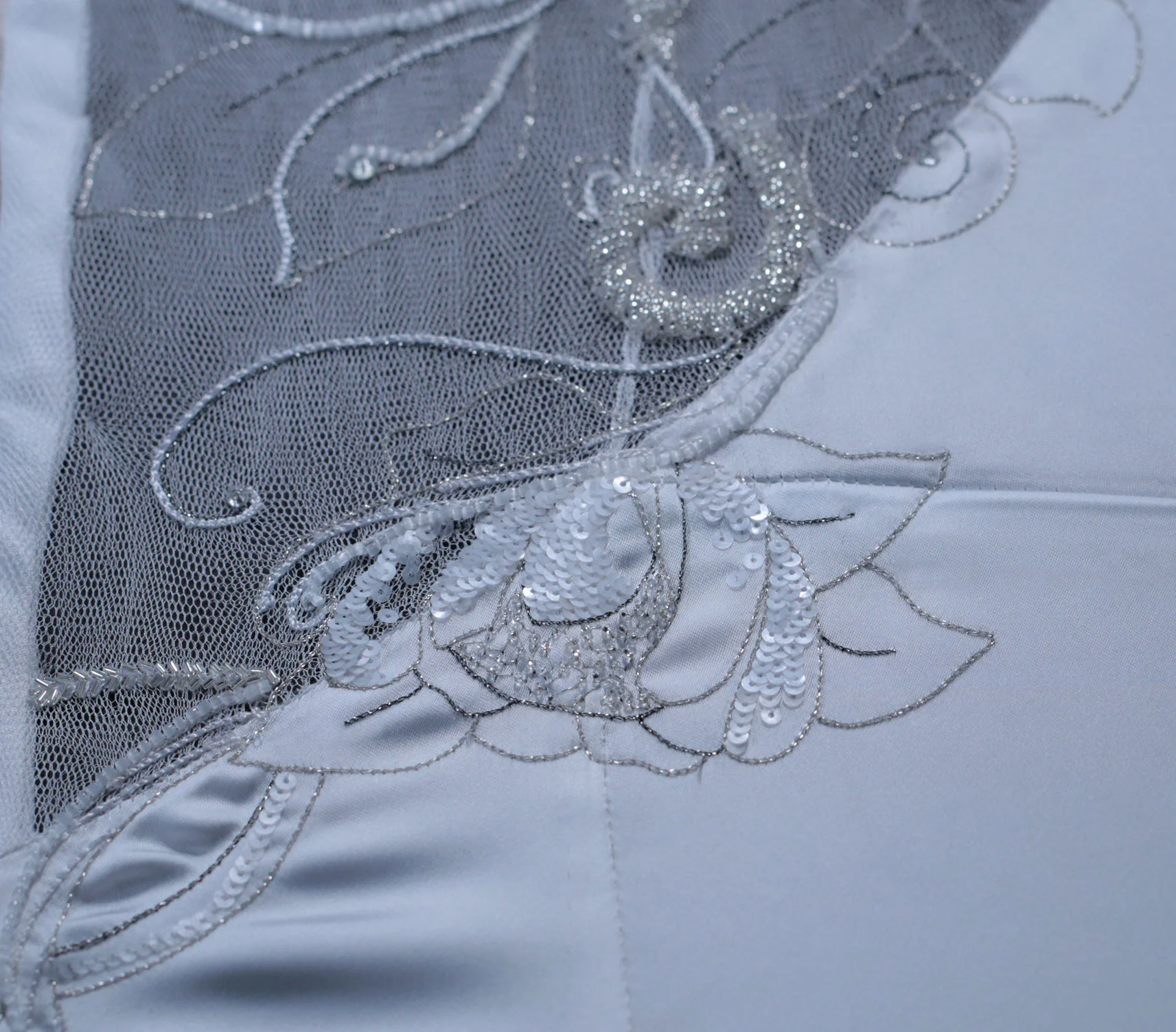 Handmade tambour embroidery with metallic thread, sequins and beads.