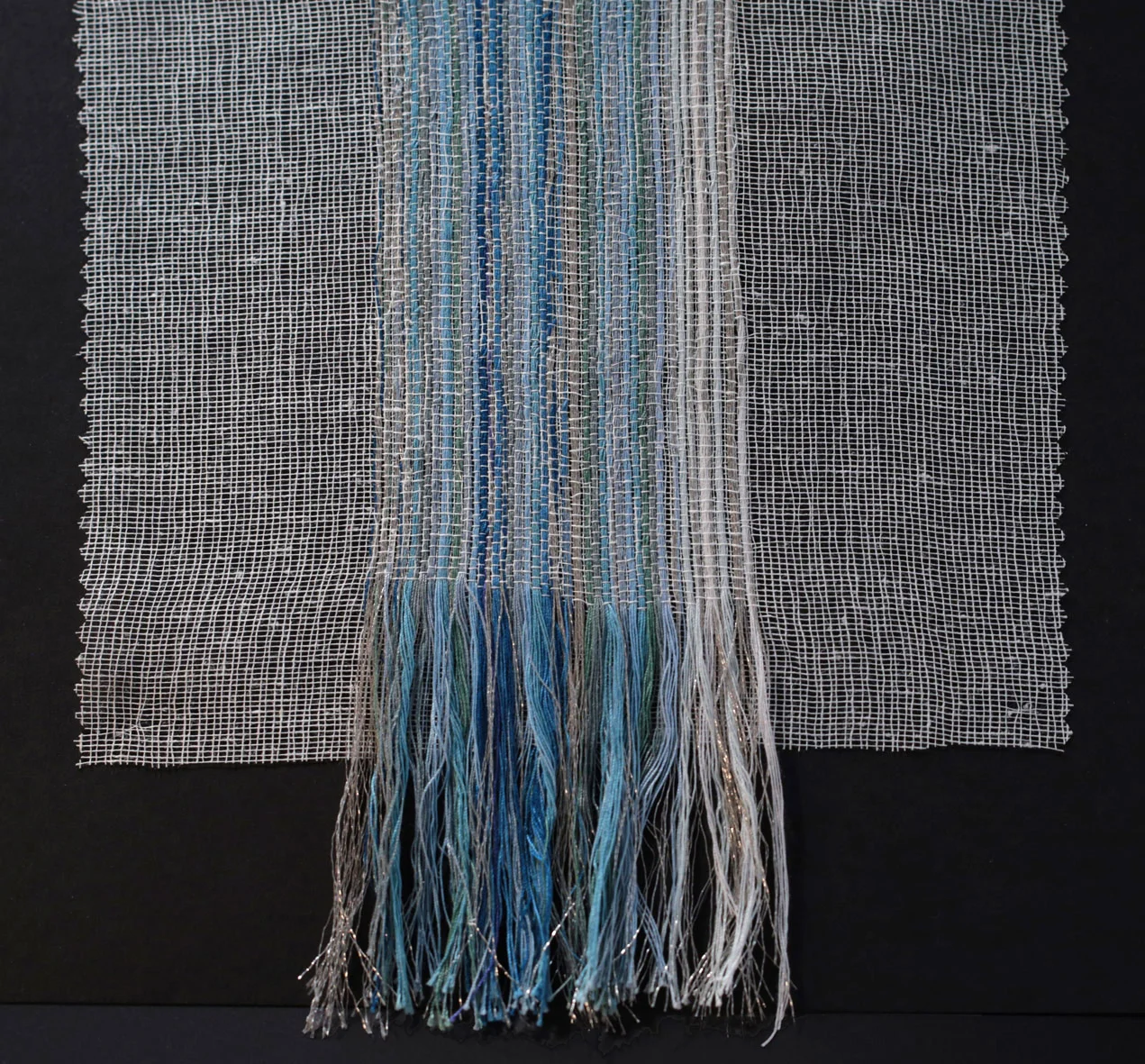 Handwoven threads throughout large canvas.