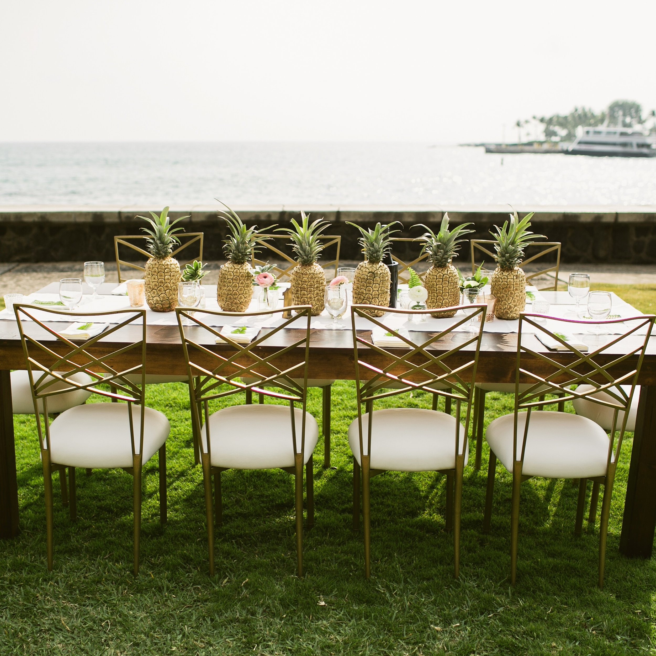 Gold Fanfare with White Leatherette Cushion with Dark Wood Farm Tables at Hulihee Palace | Decor and Design Bliss In Bloom | Photo Ruth Anne Photography