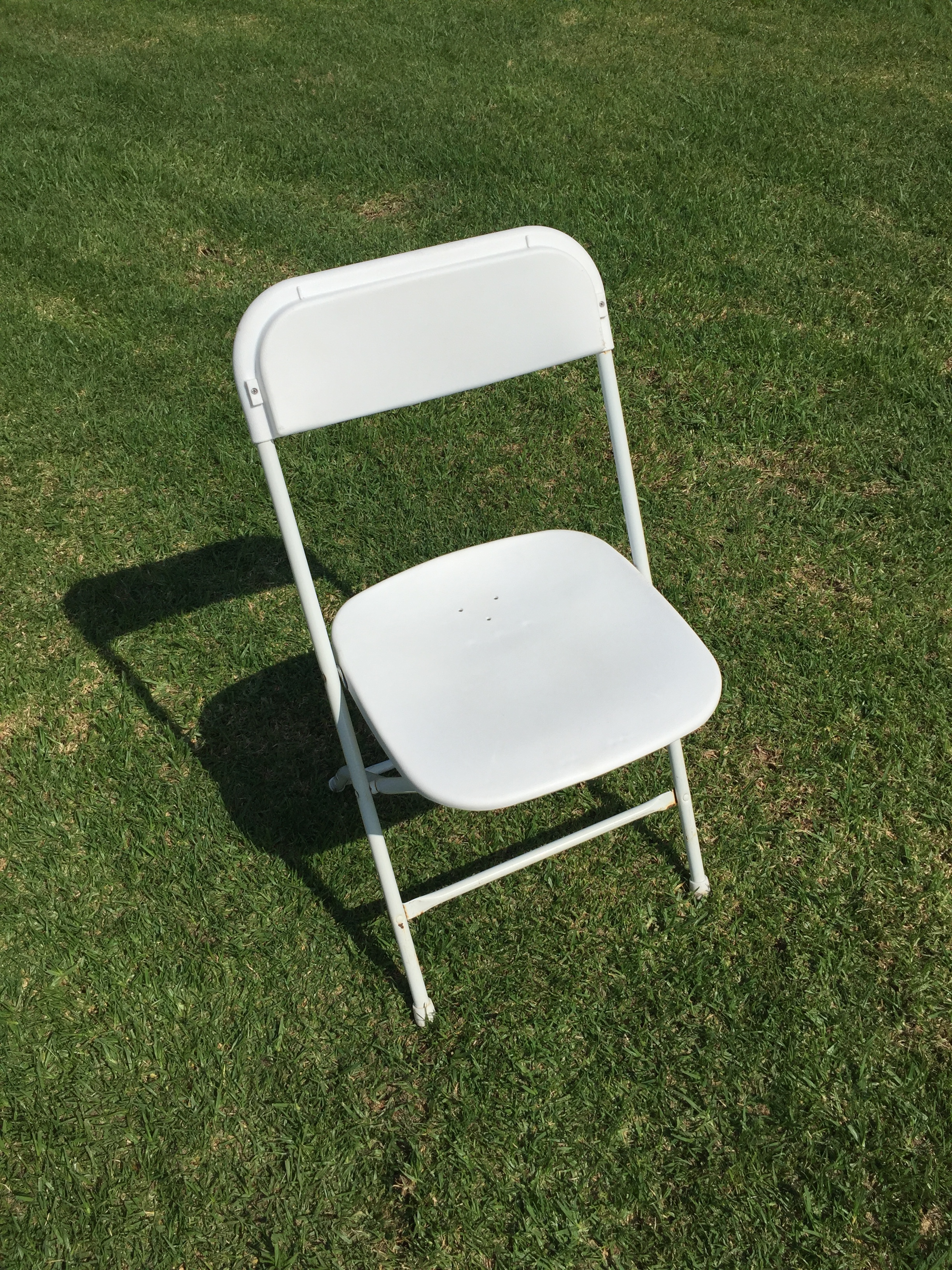 White Plastic Folding Chair Dimensions: 19" wide x 17" deep x 30" tall