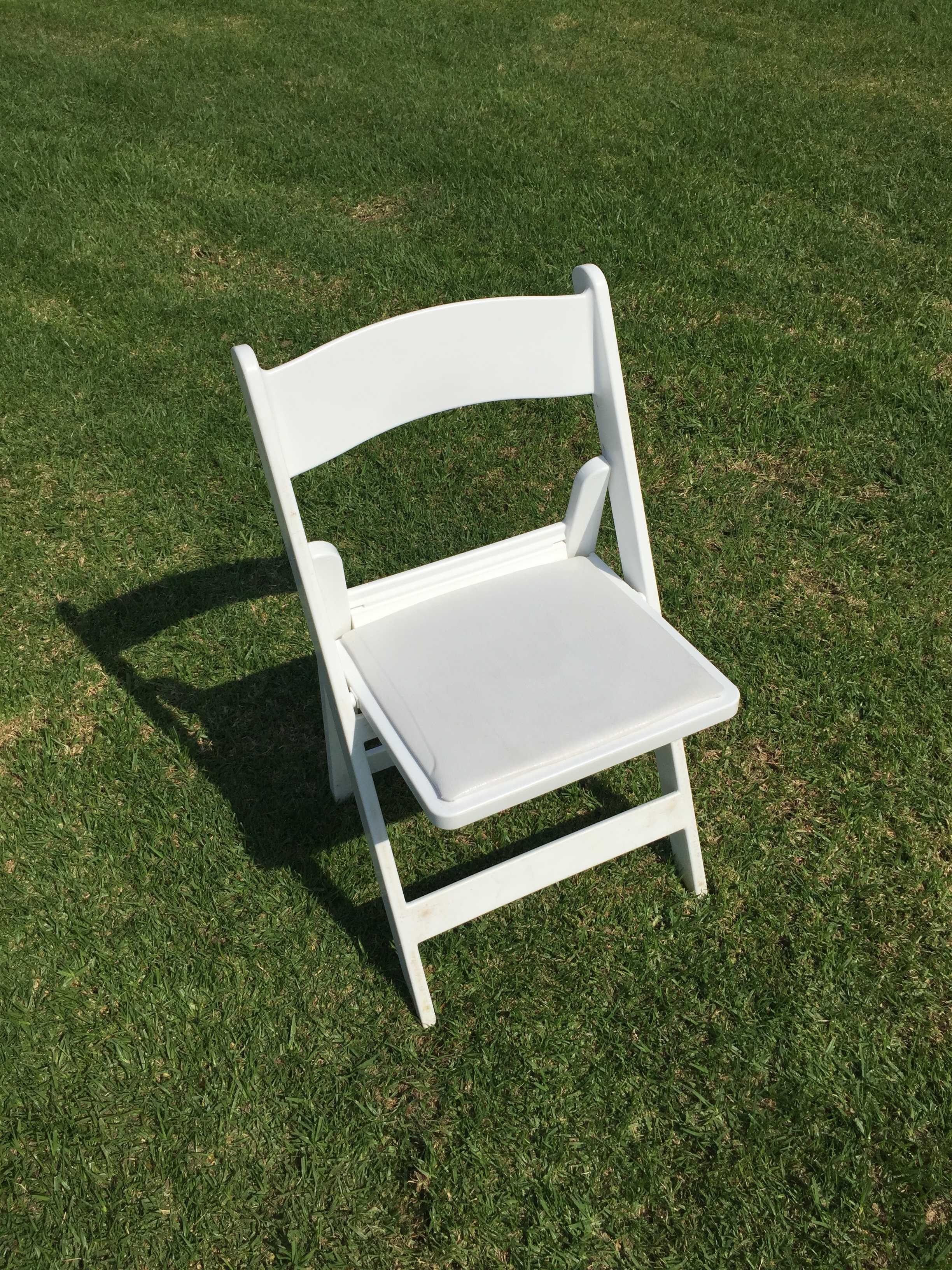 White Padded Resin Folding Chairs Dimensions: 19" wide x 17" deep x 30" tall