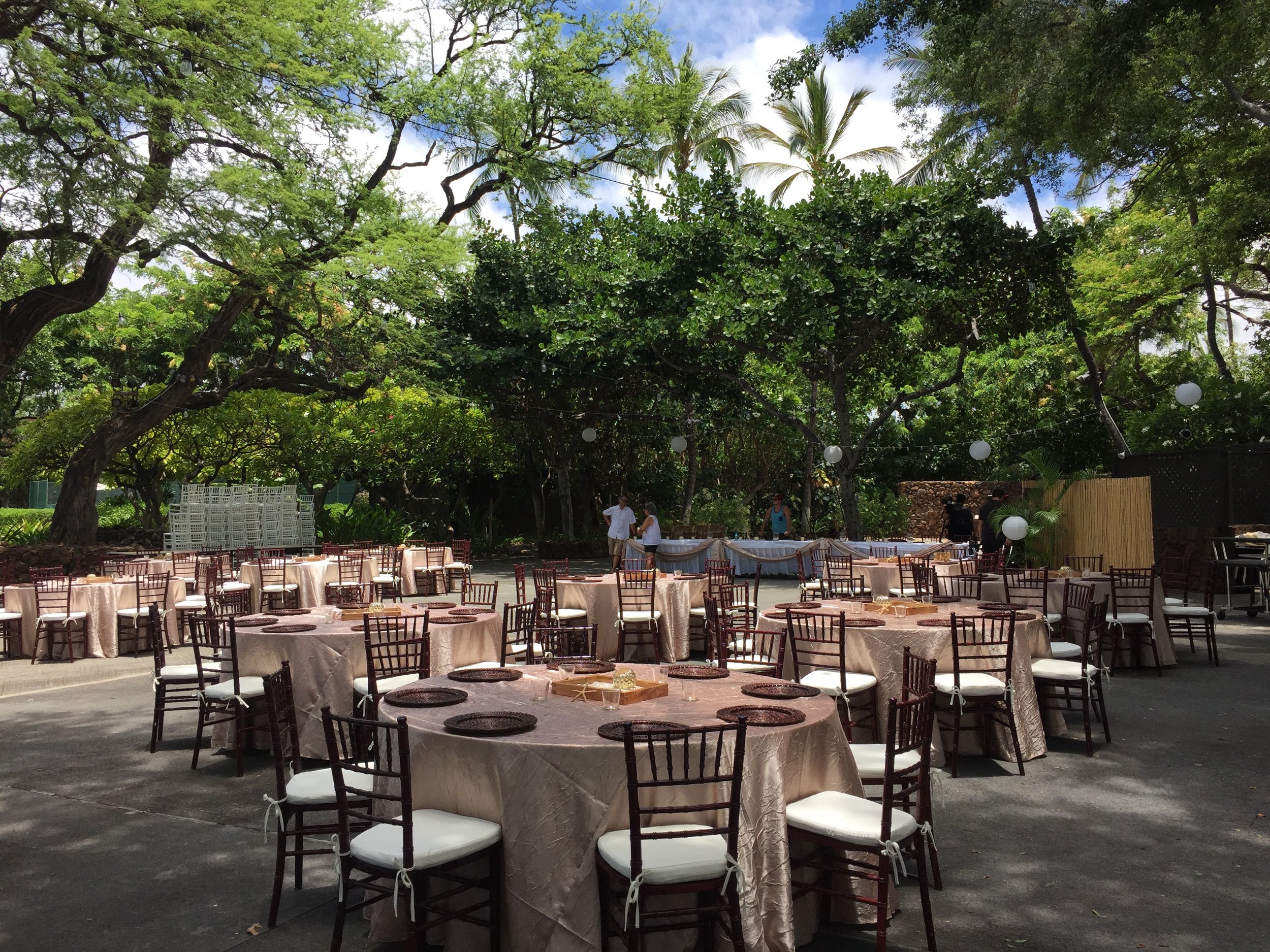 Mahogany Chiavari Chairs with Ivory Cushions for a wedding at Mauna Kea Beach Hotel North Point Luau Grounds.