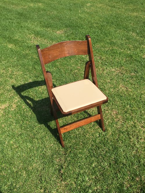 White Padded Resin Folding Chairs Dimensions: 19" wide x 17" deep x 30" tall