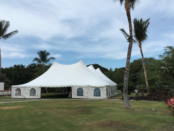 60x100 pole tent with Cathedral Windowed Side Curtains for corporate event at Mauna lani bay hotel .