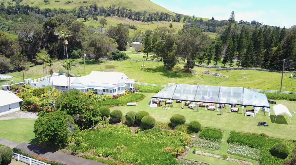 Ariel view of our Clear Tent set up with Farm Tables and Round tables at Anna's Ranch in Waimea.