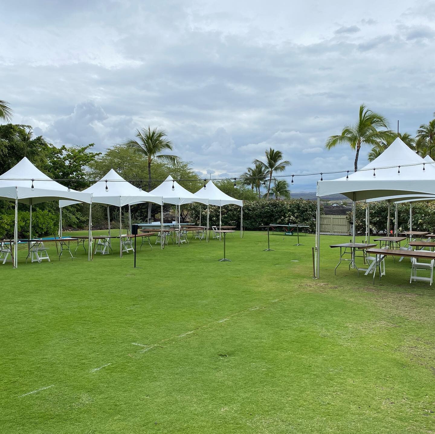 10x10s with tables, chairs, and linens for corporate event at @lavalavabeachclub for Island of Hawaii Visitors Bureau. @bigislandtents