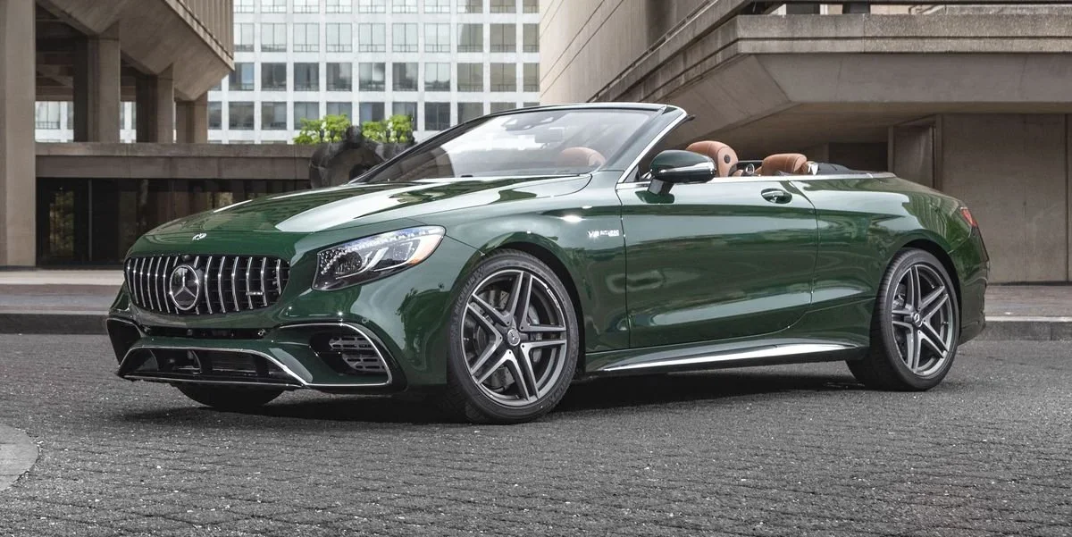 Green Mercedes-Benz convertible with polished paint reflecting sunlight..webp