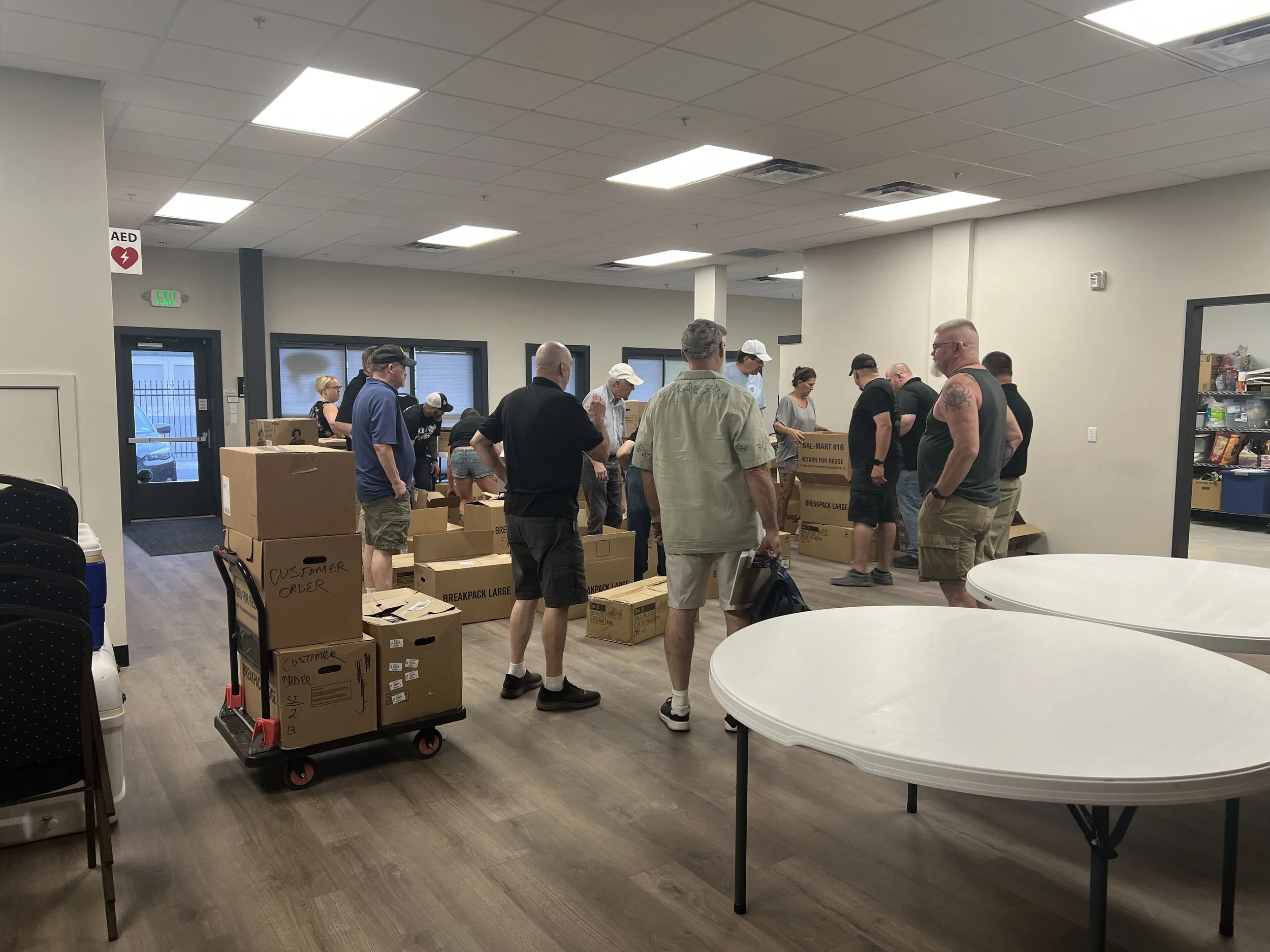 Scottish Rite members and community voluteers organize shoes for delivery