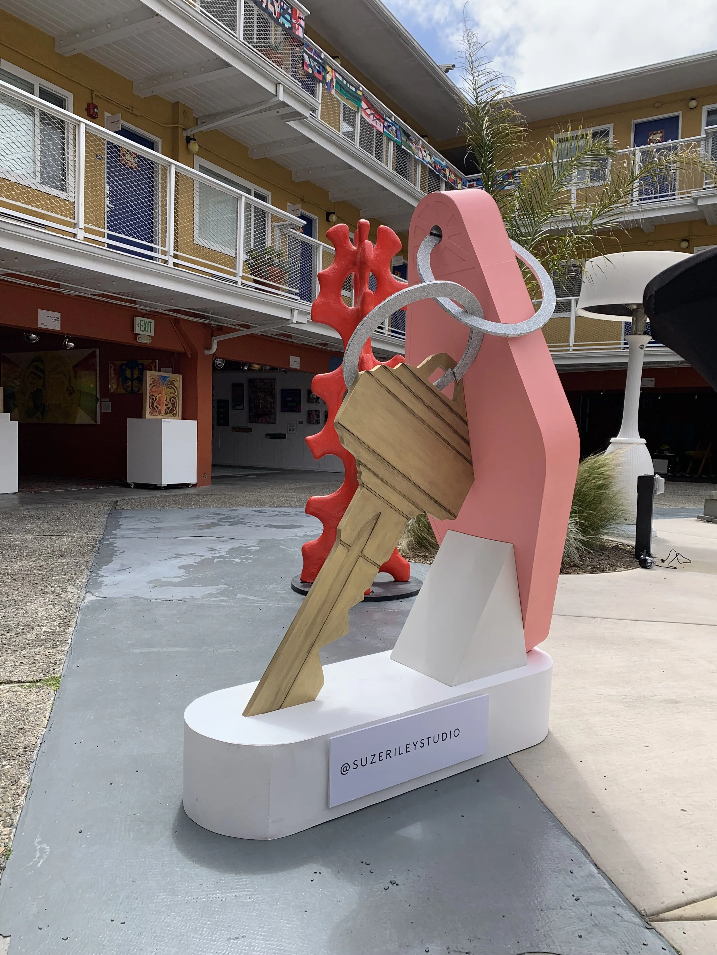 Giant motel key sculpture with pink key fob