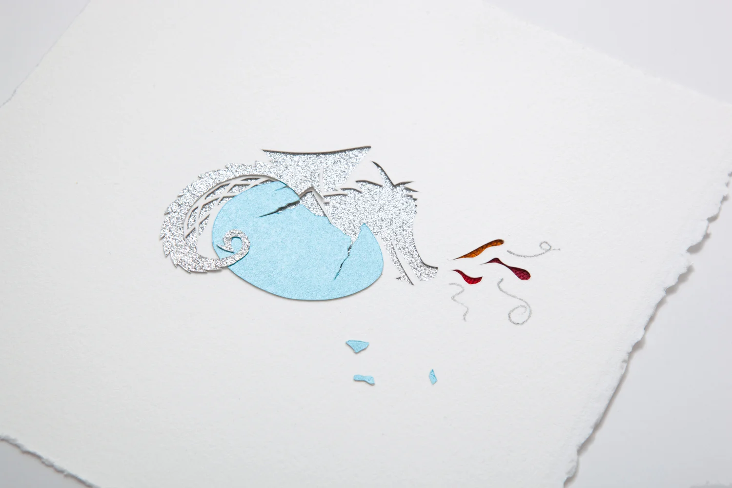 Baby dragon with blue egg in detail